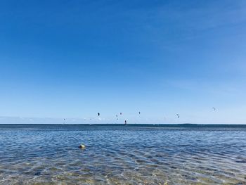 Scenic view of sea against clear blue sky