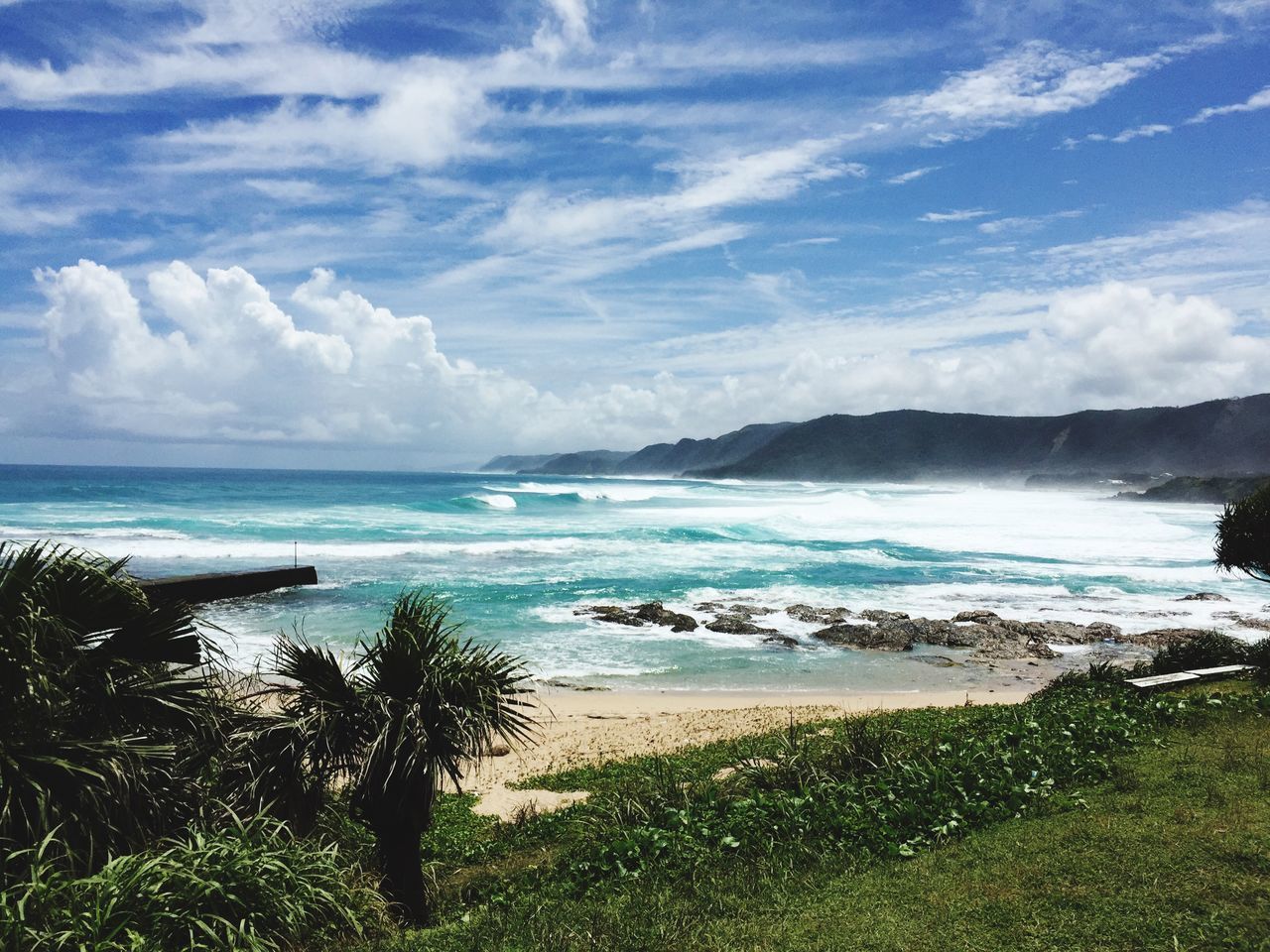 sea, water, sky, horizon over water, scenics, tranquil scene, tranquility, beauty in nature, beach, nature, cloud - sky, shore, cloud, coastline, idyllic, cloudy, day, wave, blue, grass