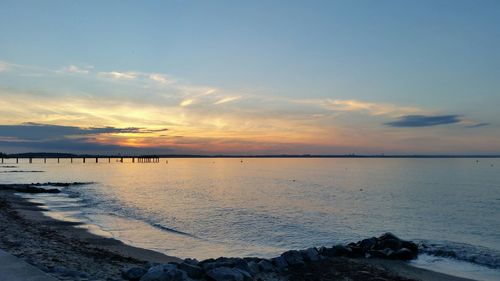 Scenic view of sea against sky at sunset