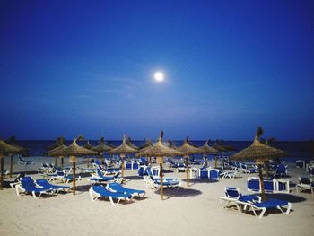 Scenic view of beach against sky at night