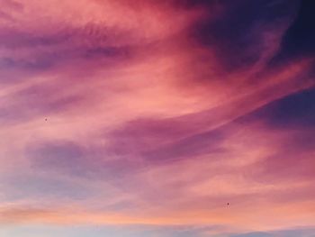 Low angle view of dramatic sky during sunset