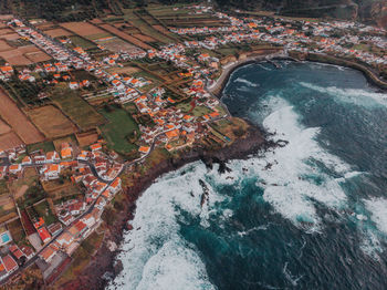 High angle view of city by sea