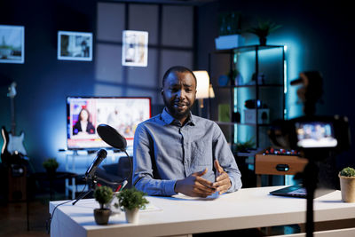 Portrait of young man working at home