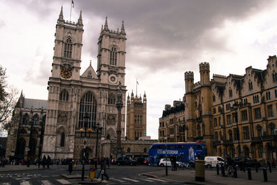 Facade of building against cloudy sky