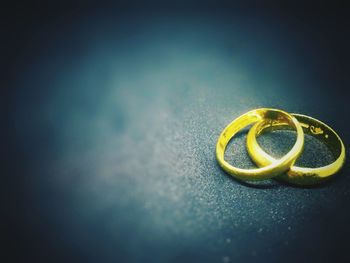 Close-up of yellow ring on table