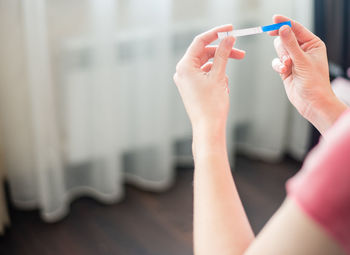 Midsection of woman holding hands