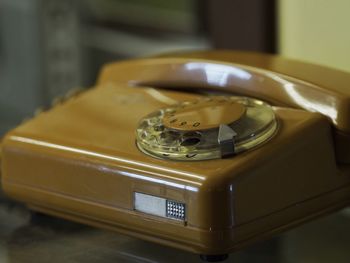 Close-up of rotary phone on table