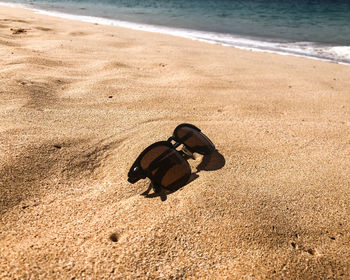 High angle view of shoes on beach