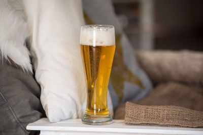 Close-up of beer glass on table