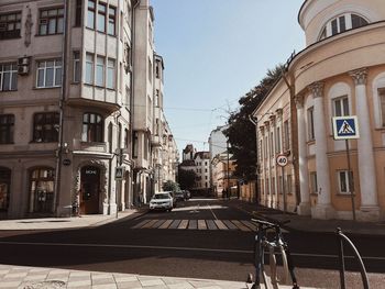 Street amidst buildings against sky in city