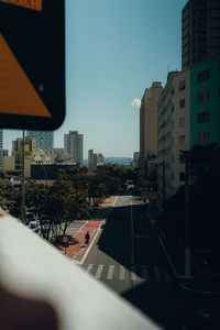 City street and buildings against sky