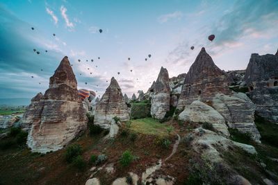 Low angle view of rock formations against sky