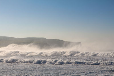 Scenic view of sea against clear sky