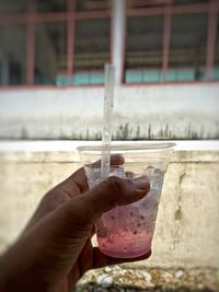 Close-up of person hand holding drink