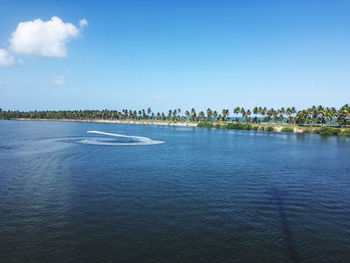 Scenic view of sea against blue sky