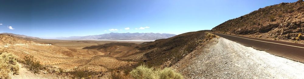 Panoramic view of road amidst mountains against sky