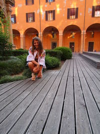 Portrait of woman sitting outdoors