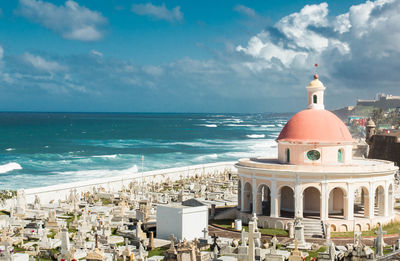 High angle view of cemetery by sea against sky