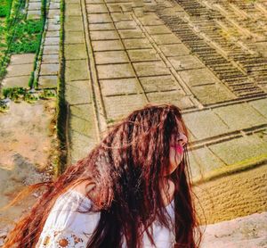 High angle view of woman standing outdoors