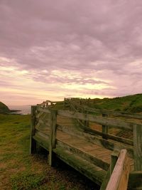Scenic view of field against sky during sunset