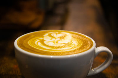 Close-up of cappuccino on table