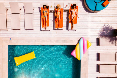 Low angle view of flags hanging on swimming pool