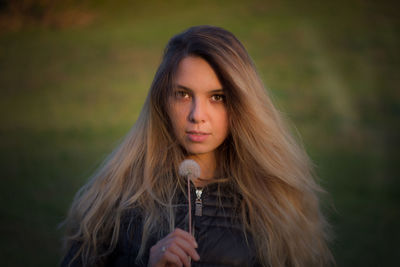 Portrait of beautiful young woman outdoors