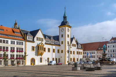 View of buildings in city against sky