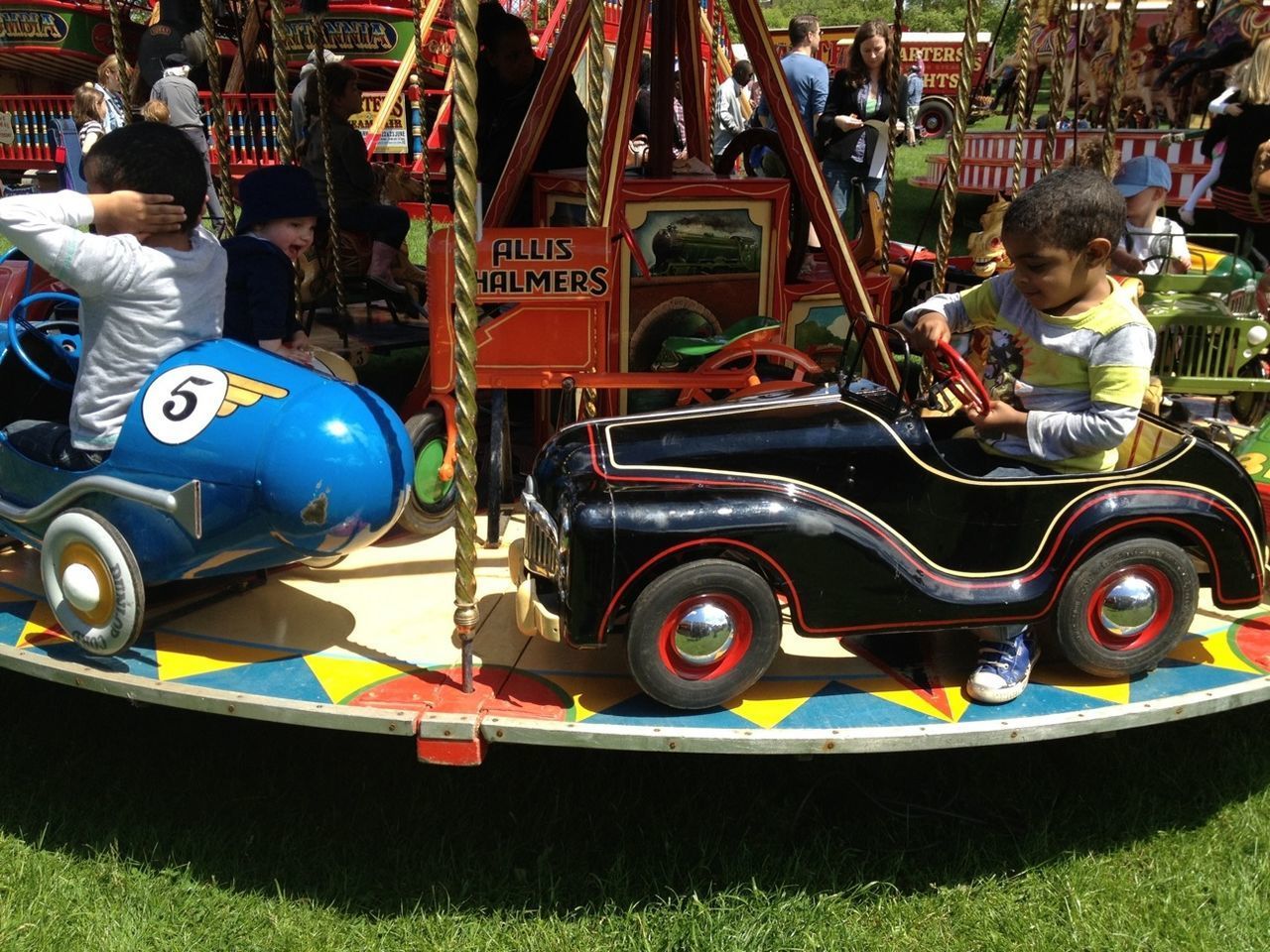 BOY AT AMUSEMENT PARK