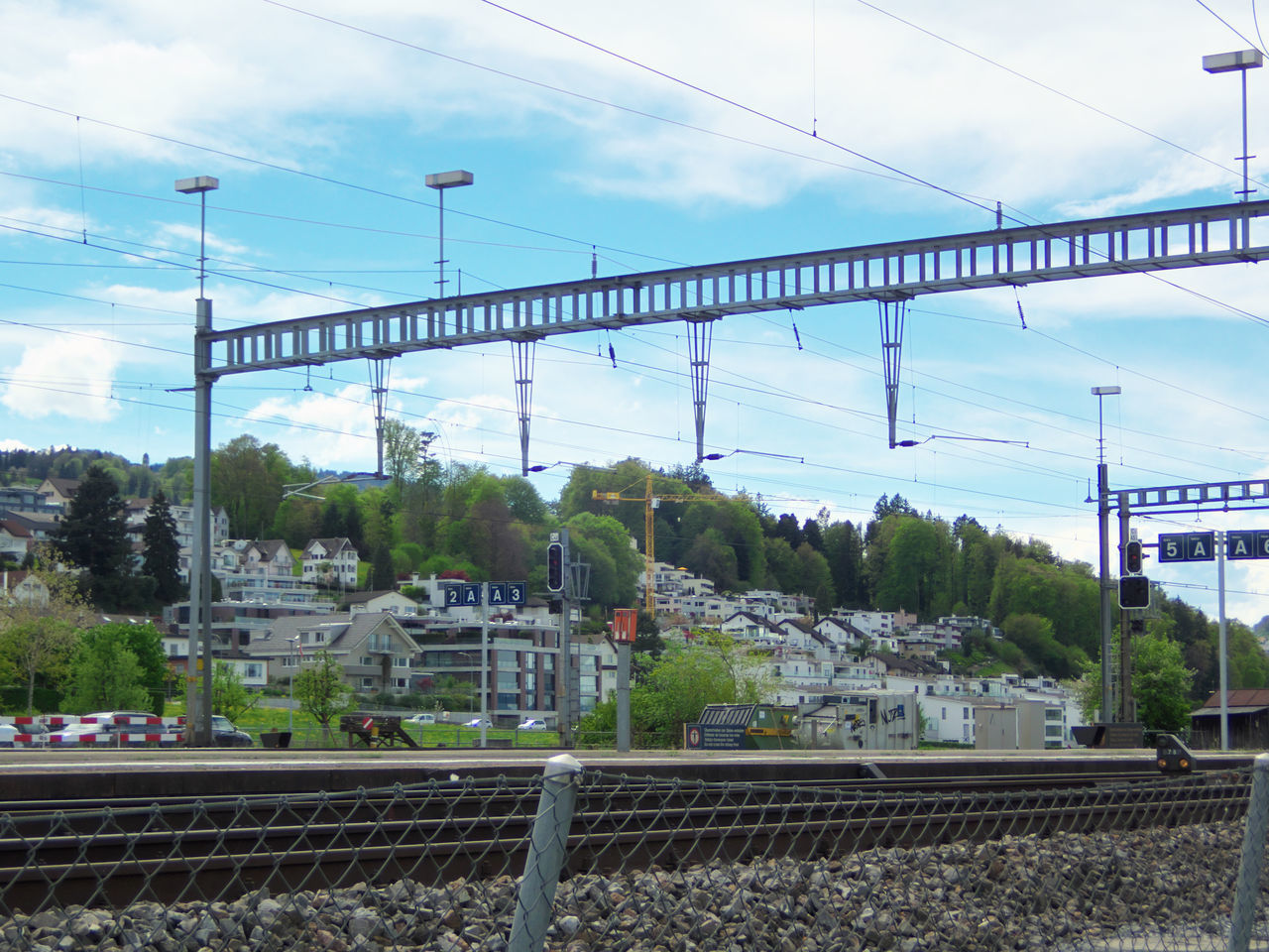 TRAIN IN CITY AGAINST SKY