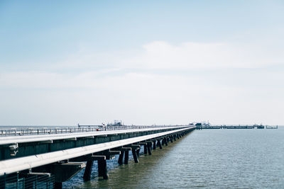 Pier over sea against sky