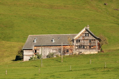 House on field against sky