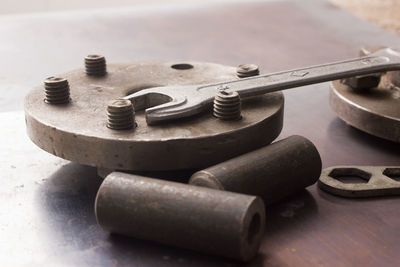 Old hand tools ,pliers screwdriver wrench rusted iron metal tools on steel plate at garage