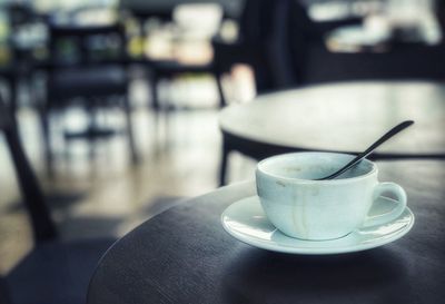 Close-up of coffee cup on table