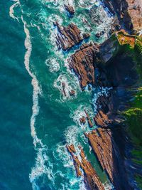 High angle view of rock formation in sea