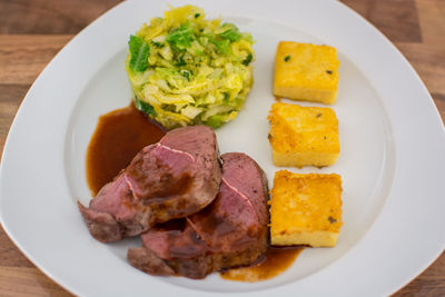 Close-up of food served in plate on table