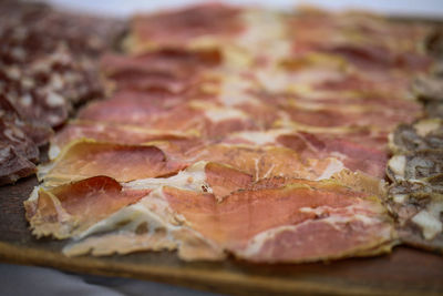 Close-up of cold cuts served in plate on table