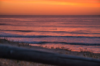 Scenic view of sea at sunset