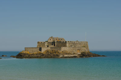 Scenic view of sea against clear sky