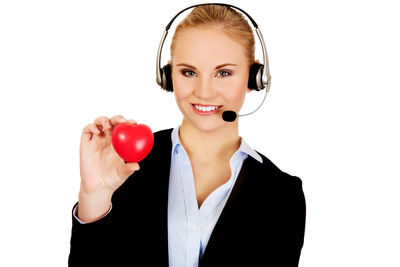 Portrait of a smiling young woman against white background