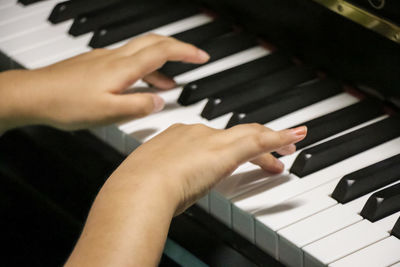 Cropped image of piano playing guitar