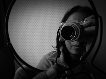 Close-up portrait of girl photographing