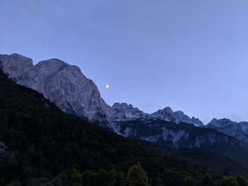 Scenic view of mountains against clear blue sky