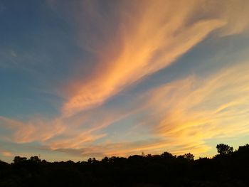 Low angle view of dramatic sky during sunset