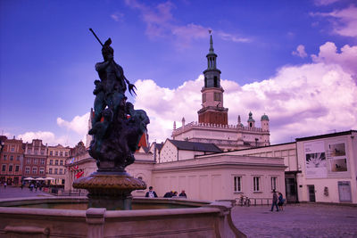 Statue of building against cloudy sky