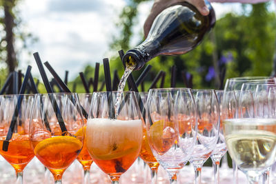Close-up of hand pouring alcohol at event
