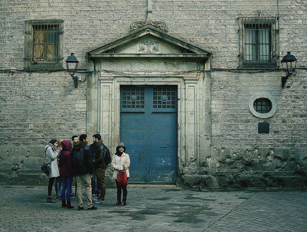 building exterior, architecture, built structure, street, full length, lifestyles, window, men, cobblestone, walking, house, building, door, leisure activity, wall - building feature, day, residential structure, residential building