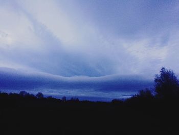 Silhouette trees against sky