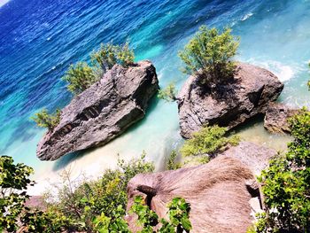 High angle view of rocks by sea