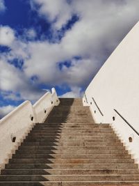 Low angle view of building against cloudy sky